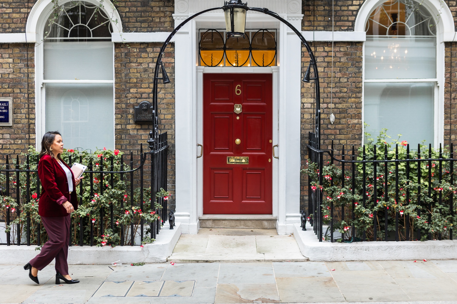 Leticia Fonseca outside a London red door
